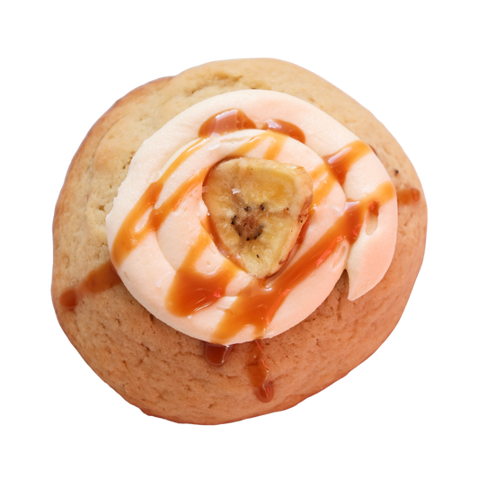 Cookie with banana and caramel topping on a white background