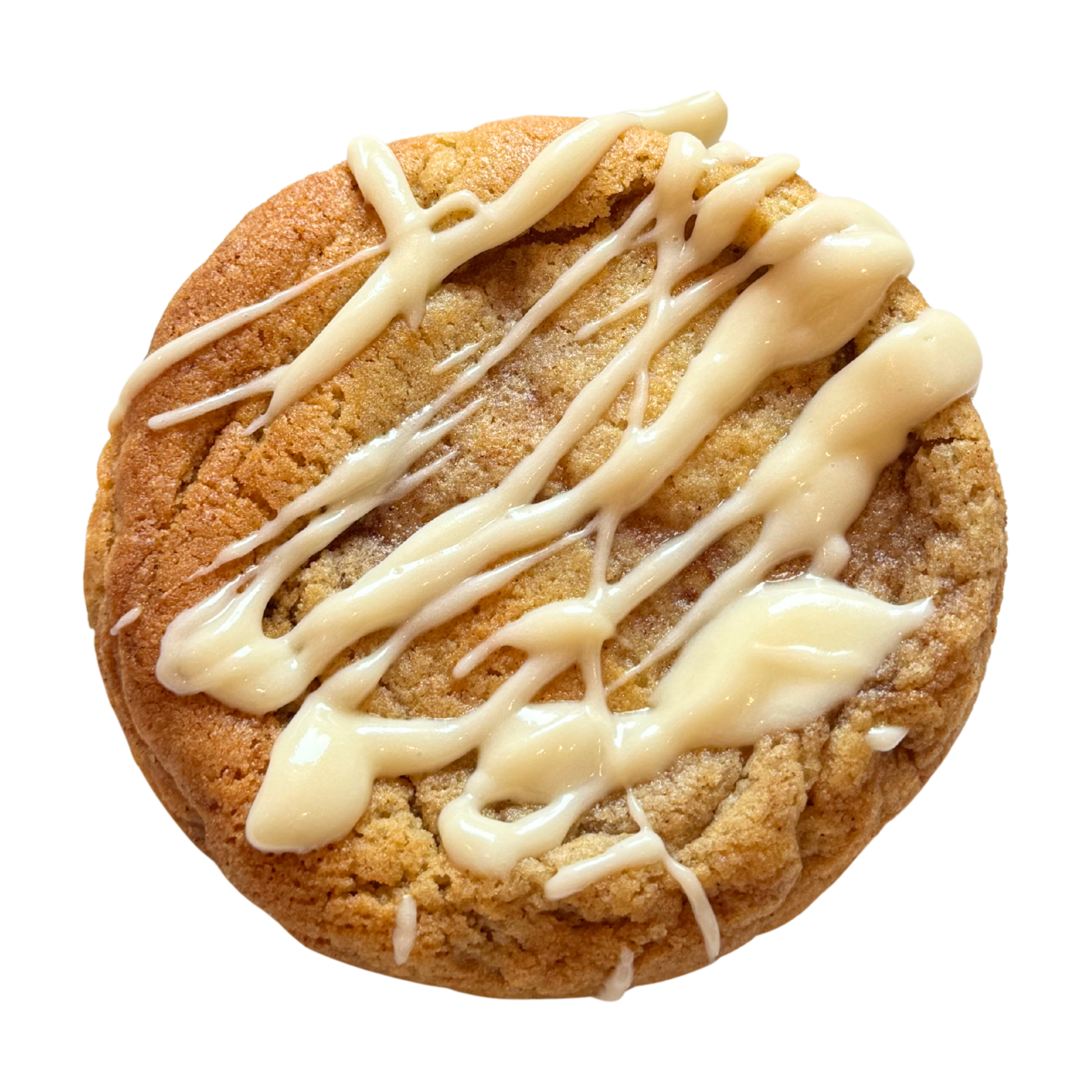 Cinnamon flavoured cookie with white glaze drizzle on a white background