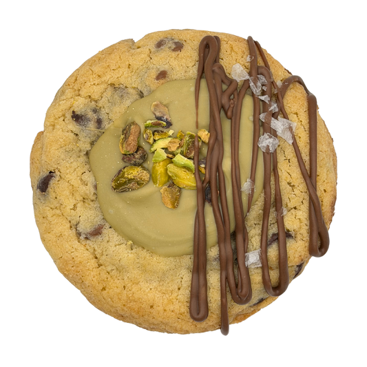 Chocolate chip cookie topped with pistachio cream and chocolate